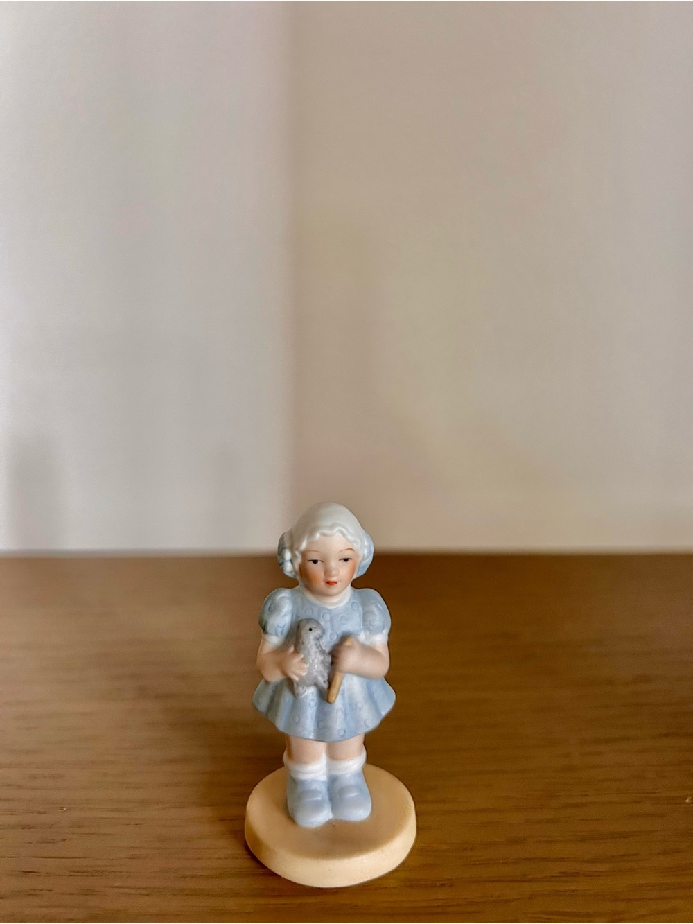 Bessie Pease Gutmann Porcelain Girl Figurine in Blue Dress Holding a Toy